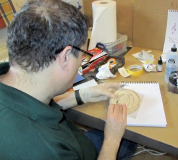 Paul cutting out templates prior to airbrushing